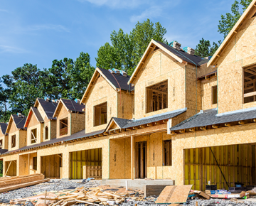 row of connected homes under construction
