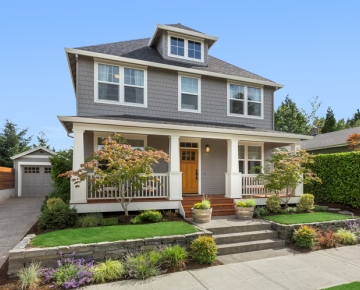 Gray home with light wood door