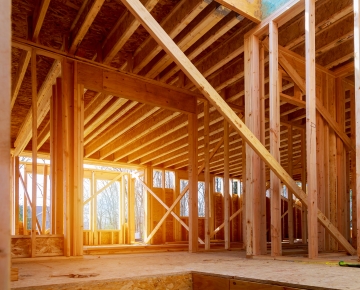 home construction with sun shining through